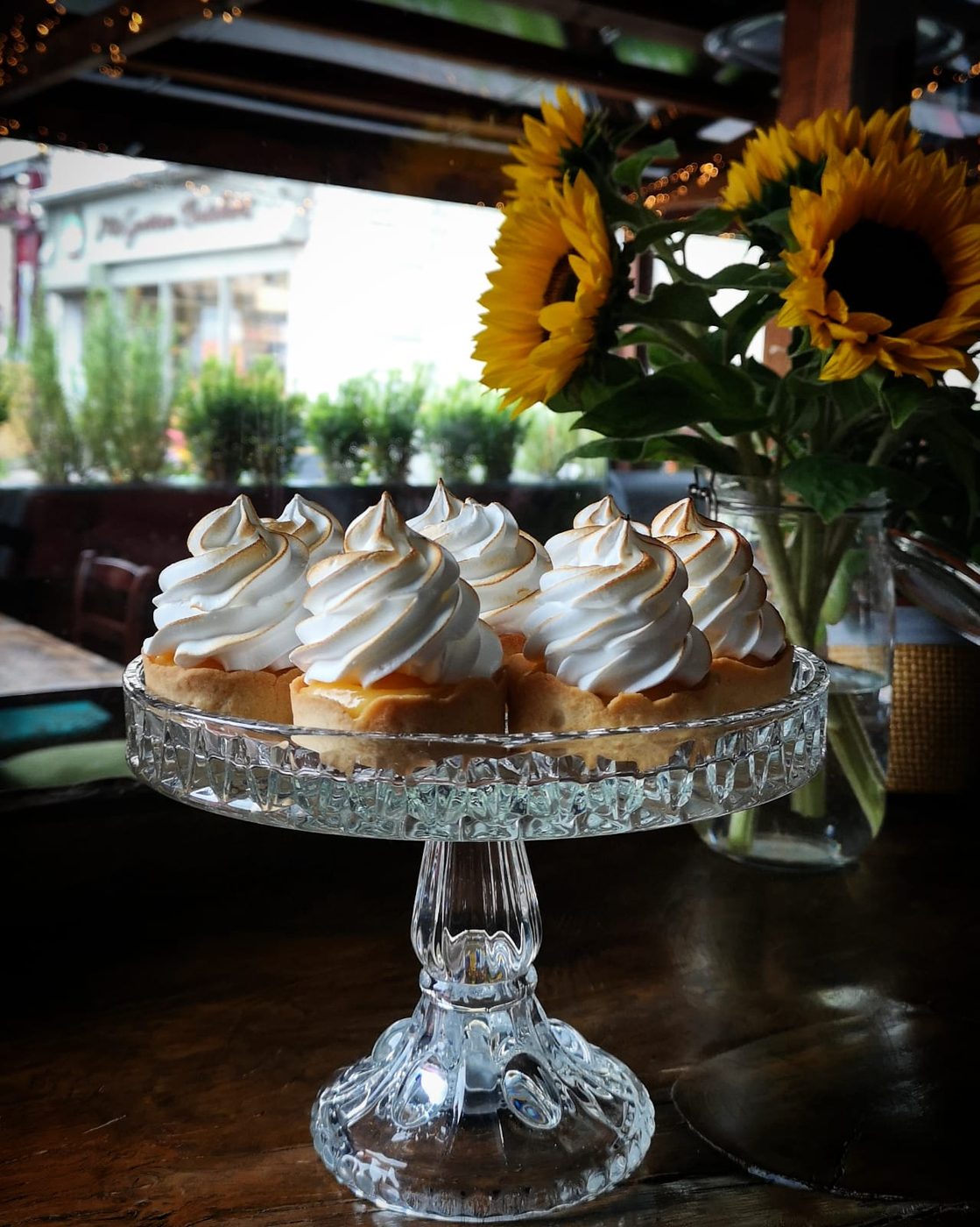 Lemon meringue tarts on a glass stand by the window at Café Nua, Belturbet